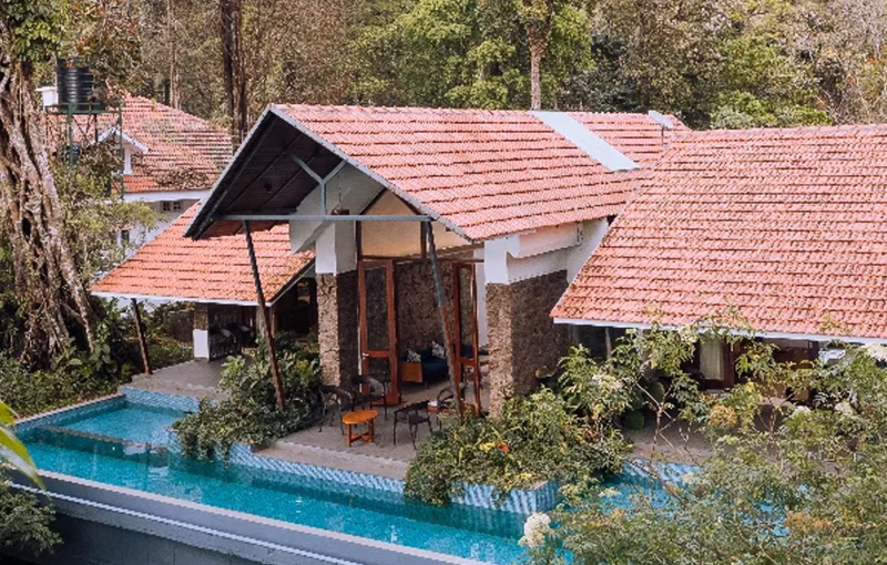 Elixir Woods Resort Munnar luxury valley view room Kerala honeymoon 2026