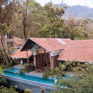 Elixir Woods Resort Munnar luxury valley view room Kerala honeymoon 2026