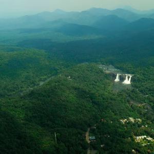 Majestic view of Athirapally Waterfalls during a private family luxury tour.