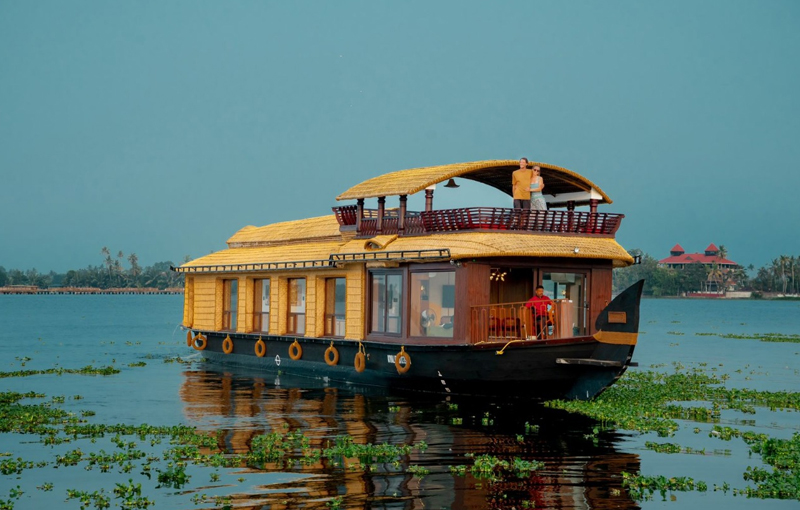 Luxury houseboat cruise in Alleppey backwaters Kerala with private bedroom, scenic canals and romantic backwater holiday experience