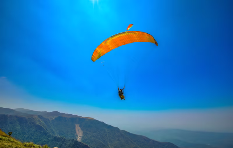 Vagamon hills in Kerala featuring rolling green meadows, misty mountains, pine forests and scenic nature holiday landscape